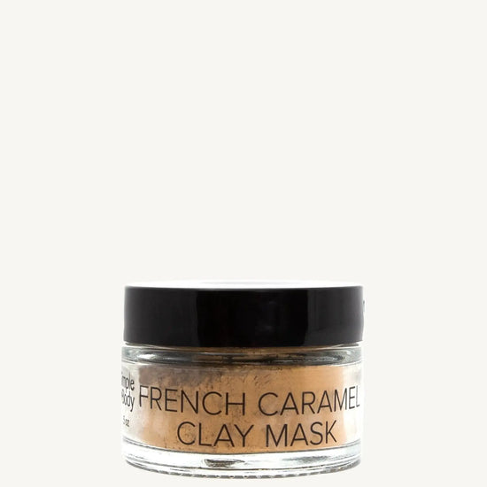 Jar of French Caramel Clay Mask on a tan background