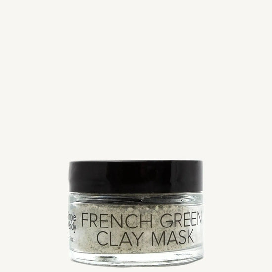 Jar of French Green Clay Mask on a tan background