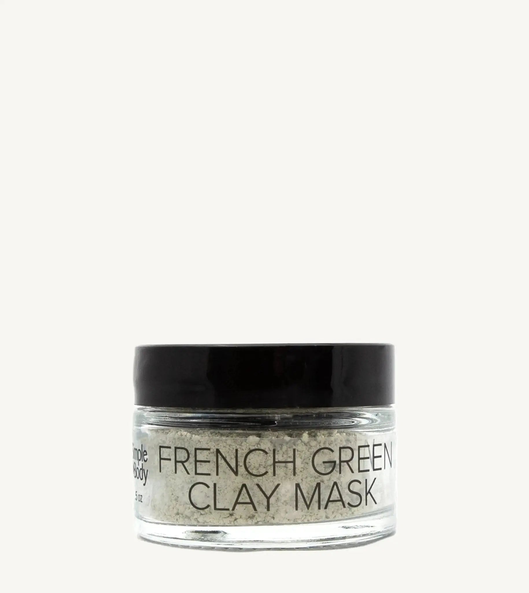 Jar of French Green Clay Mask on a tan background