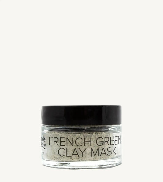 Jar of French Green Clay Mask on a tan background