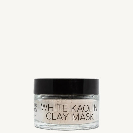Jar of white kaolin clay mask on a white background