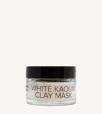 Jar of white kaolin clay mask on a white background