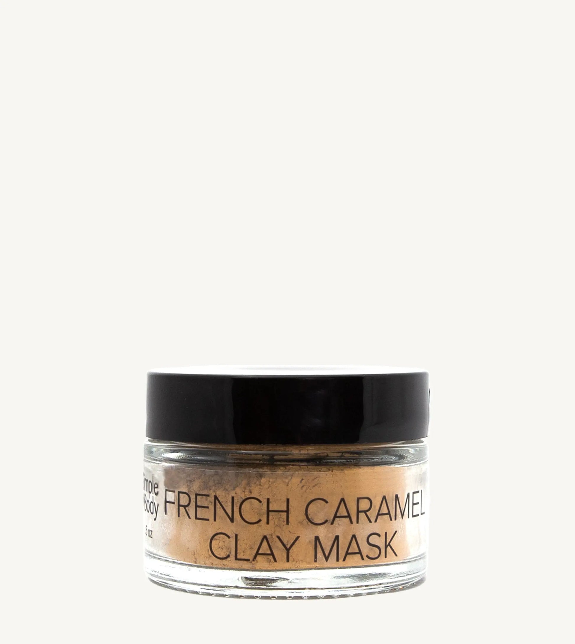 Jar of French Caramel Clay Mask on a tan background
