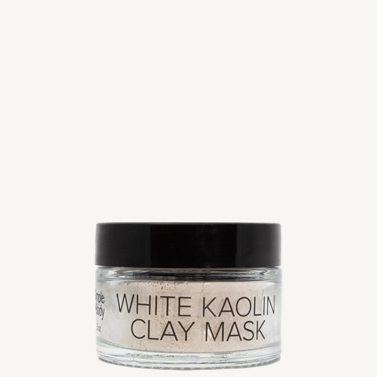 Jar of white kaolin clay mask on a white background