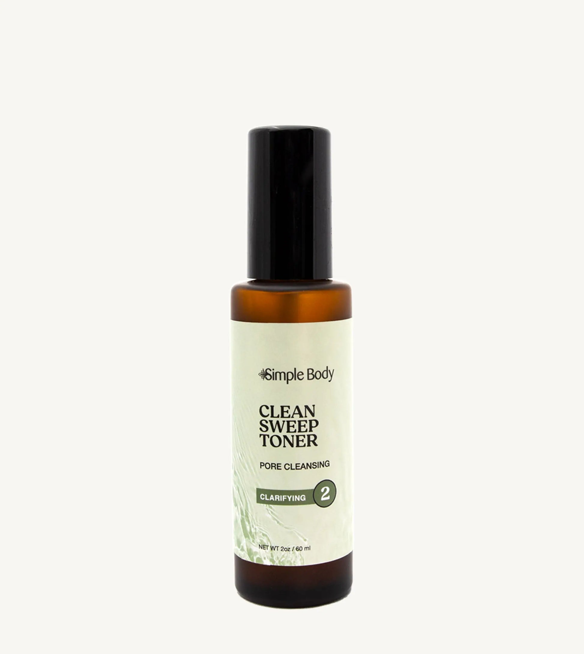 Bottle of Simple Body Clean Sweep Toner on a tan background