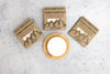 Three Rock Creek Soaps conditioner bars with packaging on a gray surface