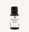 Bottle of Simple Body Cedarwood Organic Essential Oil on a white background