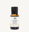 Bottle of Simple Body Citrus Burst organic essential oil blend on a white background