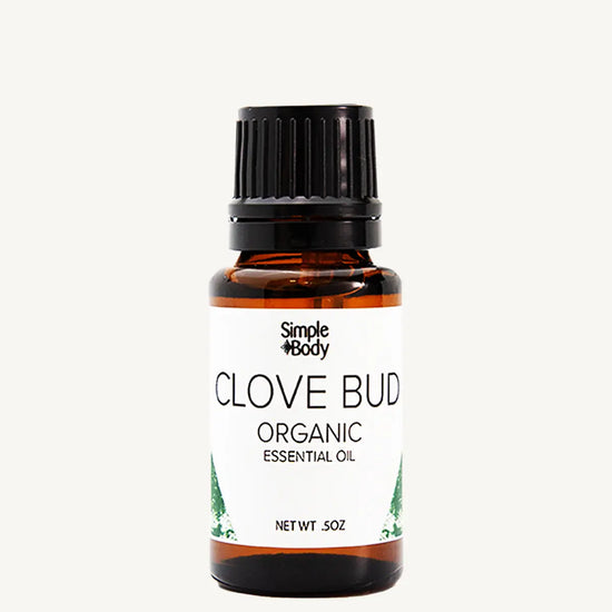 Bottle of Simple Body Clove Bud organic essential oil on a white background