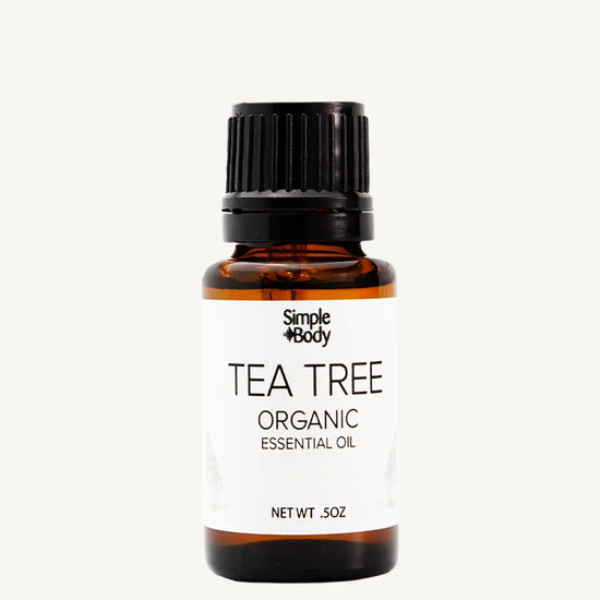 Tea tree organic essential oil bottle with a white background