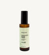A recyclable glass spray bottle labeled 'Exfoliate + Glow Tonic' by Simple Body, designed for skincare.