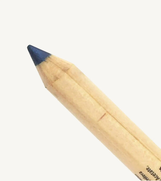 Pure Anada's Navy Eye Pencil close up on a beige background.