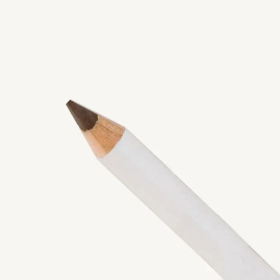 White makeup pencil with brown tip on a white background
