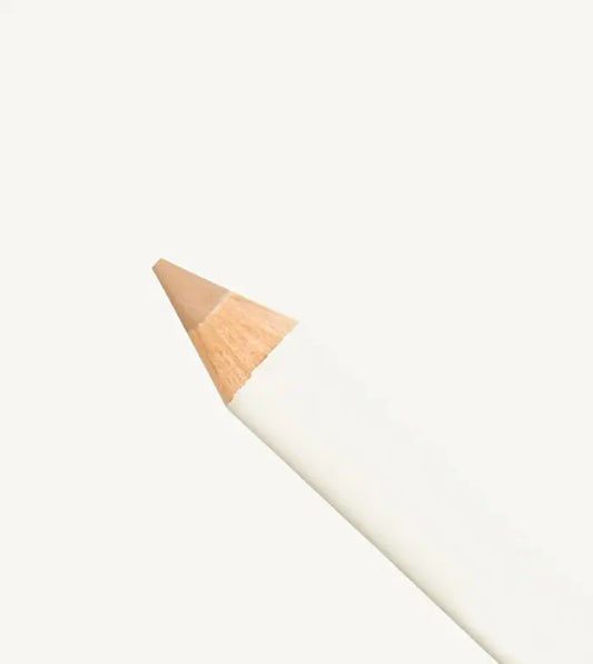 Makeup pencil with beige tan color on a white background
