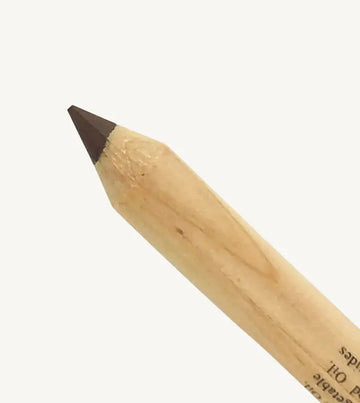 A closeup image of Pure Anada's Eyeliner pencil with brown tip on a white background