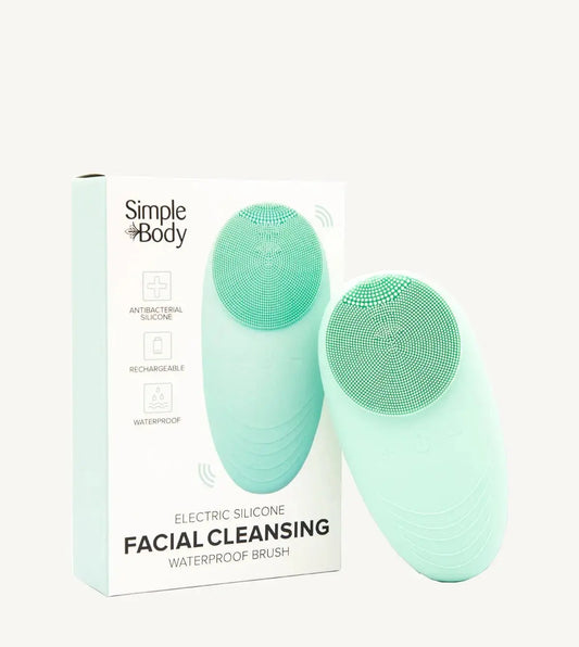 A facial cleansing brush with a silicone head, shown alongside its packaging which indicates it is waterproof and electric. The brand is Simple Body.