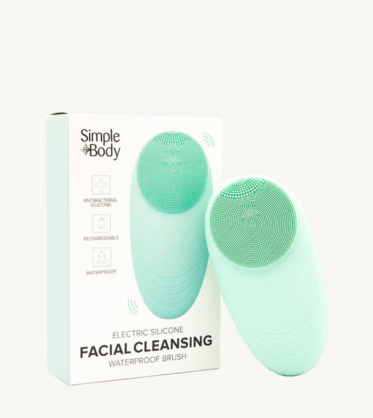 A facial cleansing brush with a silicone head, shown alongside its packaging which indicates it is waterproof and electric. The brand is Simple Body.