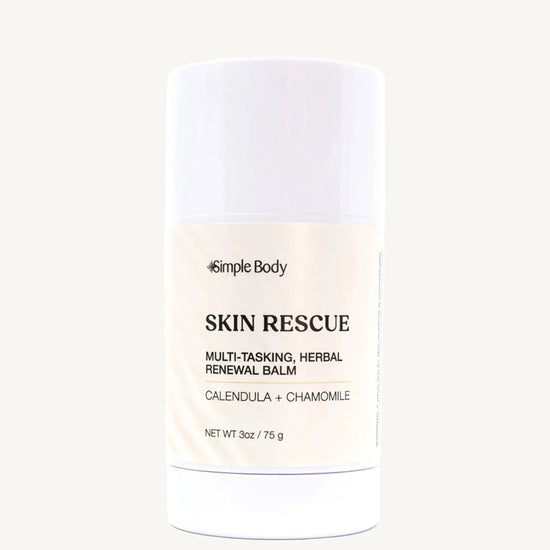 A white container of Simple Body Skin Rescue balm, labeled as multipurpose herbal balm for stressed skin.