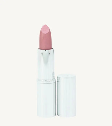 A photo of Pure Anada's Lip Stick in Prestige which is a Pink Shimmery hue in a  silver metallic tube on a tan background.