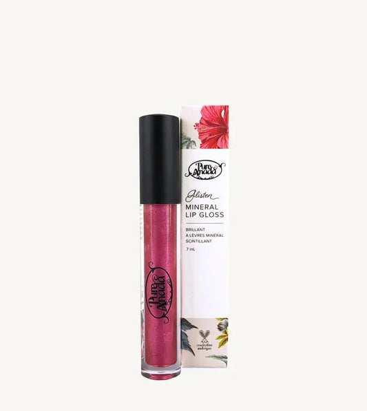 A photo of a tube of Pure Anada's Glisten Mineral Lip Gloss in a shimmery plum - red color on a tan background.