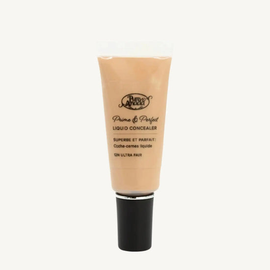 A photo of Pure Anada's Liquid Concealer in Ultra Fair which is a warm beige with yellow undertones on a tan background.