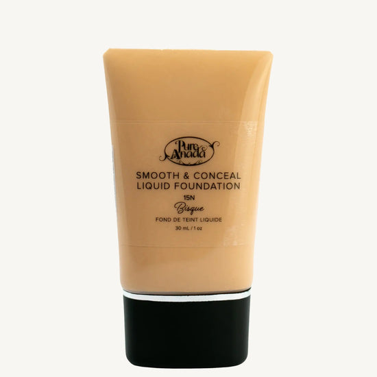 A Bottle of Pure Anada Smooth & Conceal Liquid Foundation in Bisque 15N color which is a warm beige color with yellow undertone on a white background.