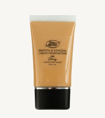 A bottle of Pure Anada Smooth & Conceal Liquid Foundation in Honey 40W which is a warm to darker beige with warm undertones on a white background.