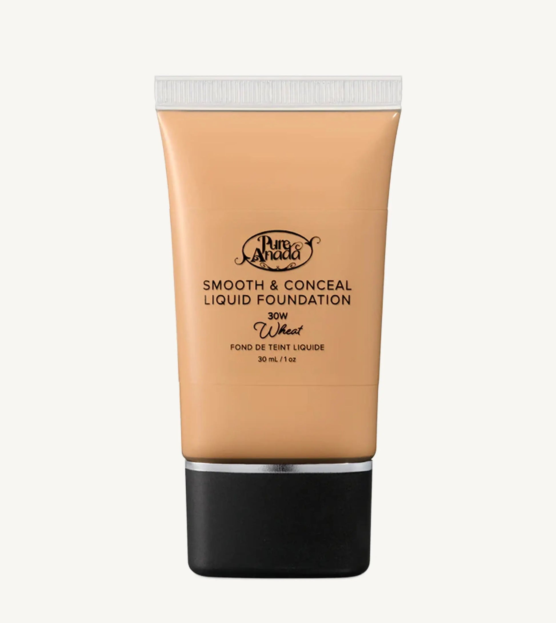 A close up photo of a liquid foundation in Wheat which is a warm beige honey color on a white background.