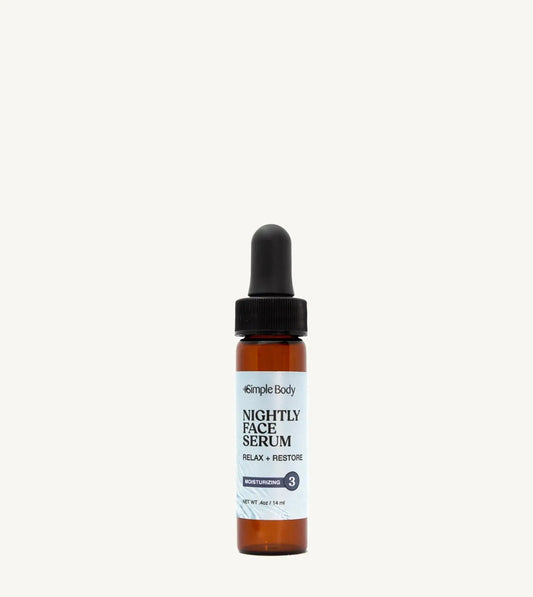 An amber glass bottle with a black pump dispenser labeled 'Nightly Facial Serum' from Simple Body, indicating it's a moisturizing skincare product.