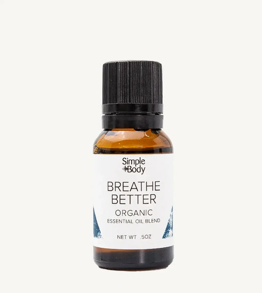 Bottle of Simple Body 'Breathe Better' organic essential oil blend on a white background