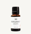 Bottle of Simple Body Bergamot Organic Essential Oil on a white background