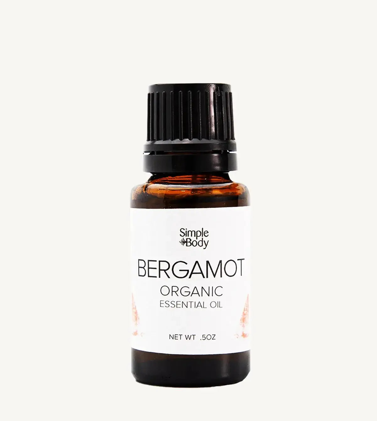 Bottle of Simple Body Bergamot Organic Essential Oil on a white background