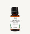 Bottle of Simple Body Cedarwood Organic Essential Oil on a white background