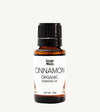 Bottle of Simple Body Cinnamon Organic Essential Oil on a white background