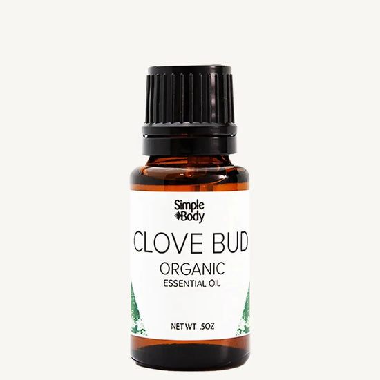 Bottle of Simple Body Clove Bud organic essential oil on a white background