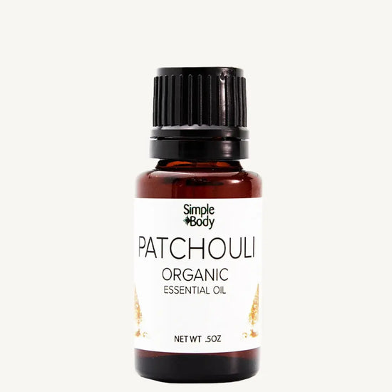 Bottle of Simple Body Patchouli Organic Essential Oil on a white background