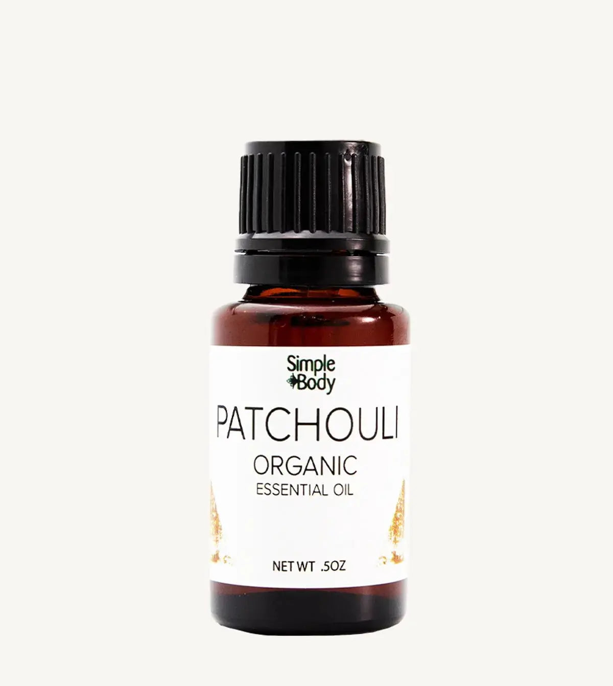 Bottle of Simple Body Patchouli Organic Essential Oil on a white background