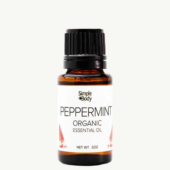 Bottle of peppermint organic essential oil with a white background