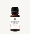 Bottle of peppermint organic essential oil with a white background