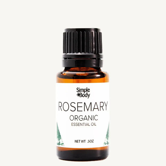 Bottle of Simple Body Rosemary Organic Essential Oil on a white background