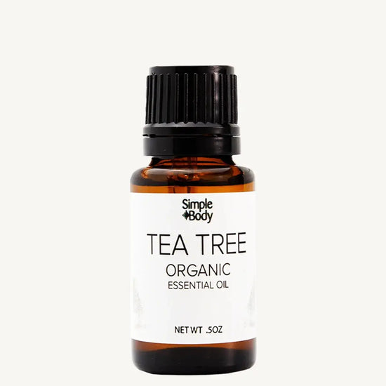 Tea tree organic essential oil bottle with a white background