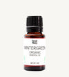 Bottle of Simple Body Wintergreen Organic Essential Oil on a white background