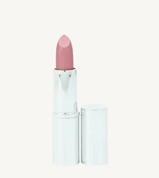 A photo of Pure Anada's Lip Stick in Prestige which is a Pink Shimmery hue in a  silver metallic tube on a tan background.