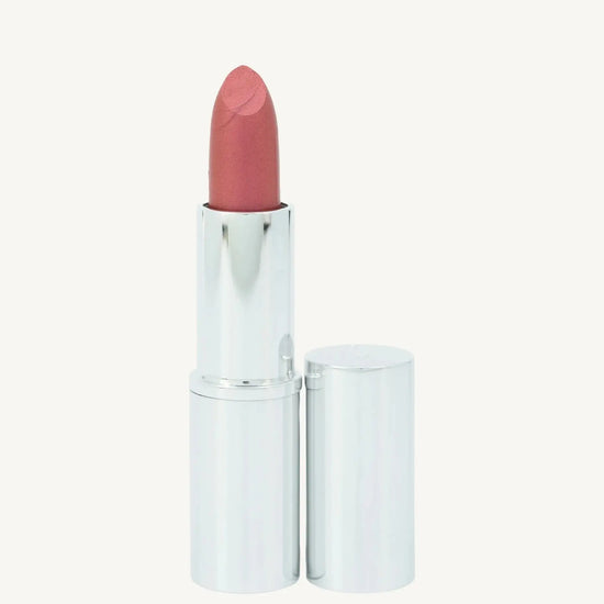 Pinkish, red hue lipstick by Pure Anada with silver case on a white background
