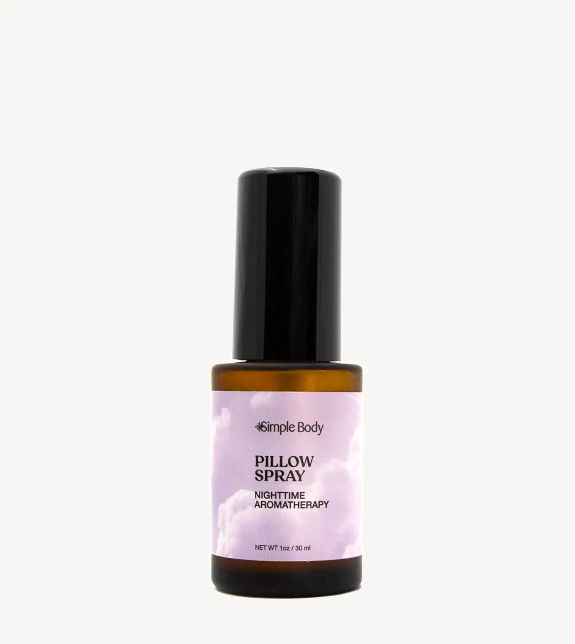 A small amber colored mist bottle labeled Pillow Spray with purple and white color label, indicating it is a nighttime aromatherapy product.