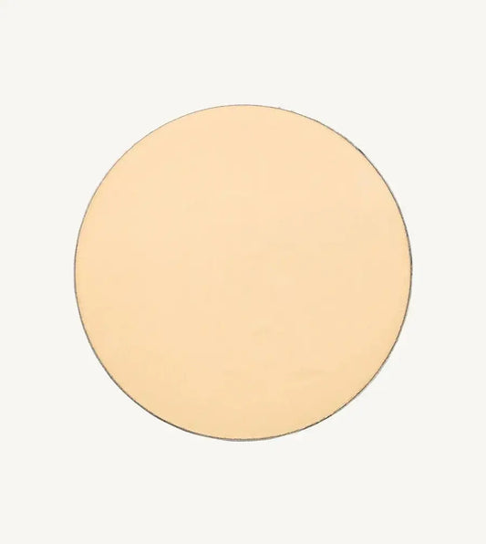 A photo of Pure Anada's Pressed Translucent Setting Powder in Matte which is a light yellow / pink color on a tan background.