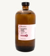 Brown bottle of Simple Body foaming face wash  in Rose for Tightening and Toning on a white background