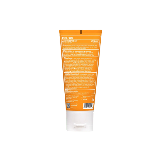 Back view of a skincare product tube with an orange label on a white background