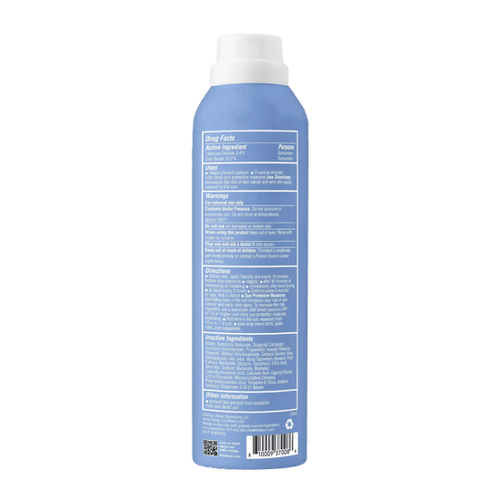 Blue sunscreen bottle with a white cap on a white background