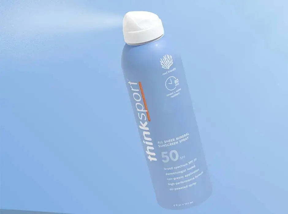 thinksport sunscreen spray bottle on a light blue background